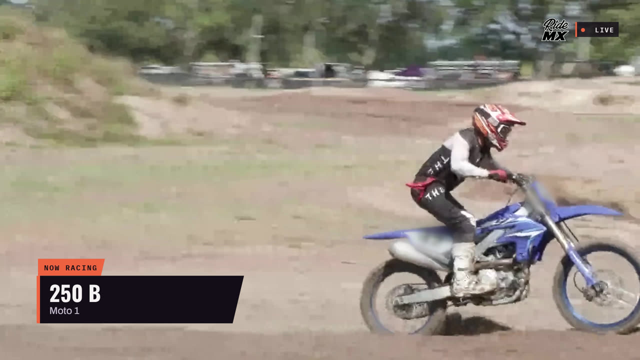 RideMX broadcast frame with a “Now racing — 250 B, Moto 1” lower third over a rider on track