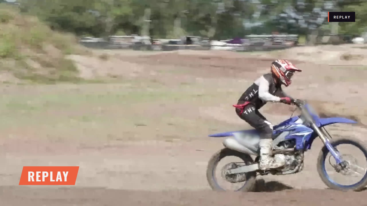 Full-screen replay graphic over a motocross rider
